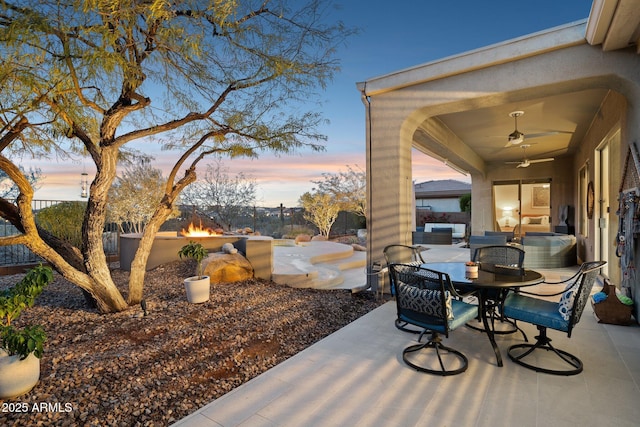 patio terrace at dusk with ceiling fan