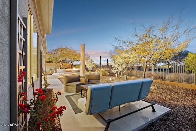 view of patio terrace at dusk