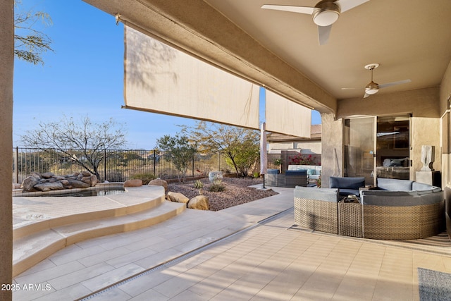 view of patio with outdoor lounge area and ceiling fan