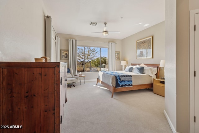 bedroom featuring light colored carpet and ceiling fan