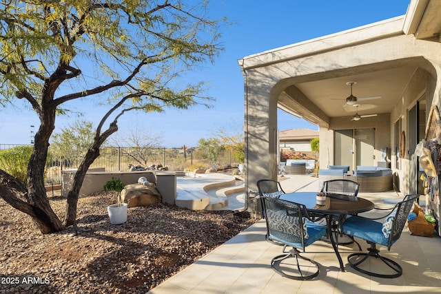 view of patio featuring ceiling fan