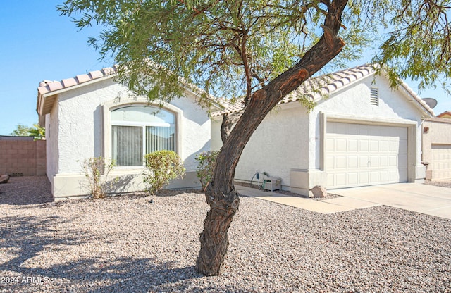 ranch-style house featuring a garage