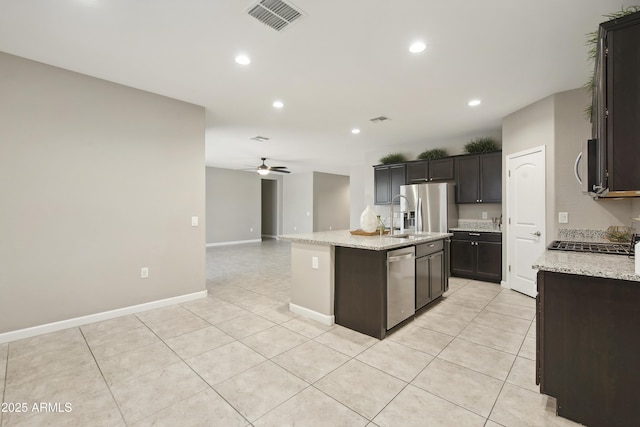 30776 W Earll Dr, Buckeye, AZ 85396 - kitchen featuring stainless steel appliances, a ceiling fan, light tile patterned floors, recessed lighting, and an island with sink