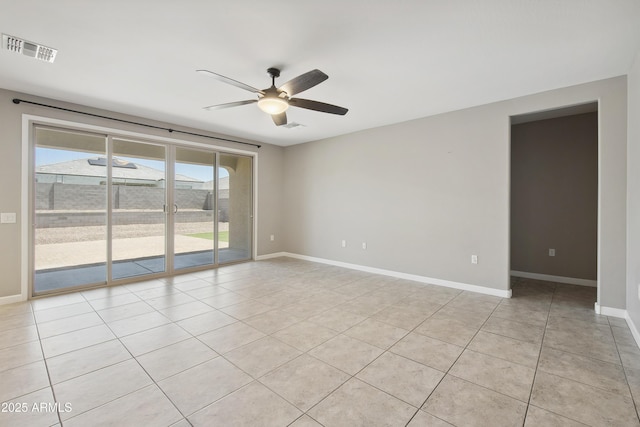 30776 W Earll Dr, Buckeye, AZ 85396 - empty room featuring ceiling fan, light tile patterned floors, and baseboards
