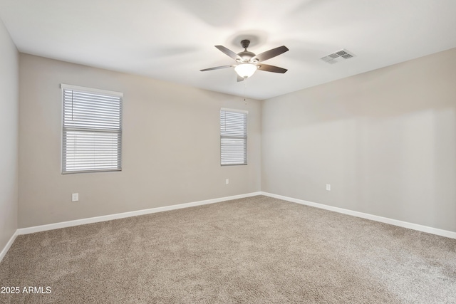 30776 W Earll Dr, Buckeye, AZ 85396 - empty room featuring a ceiling fan, carpet floors, and baseboards