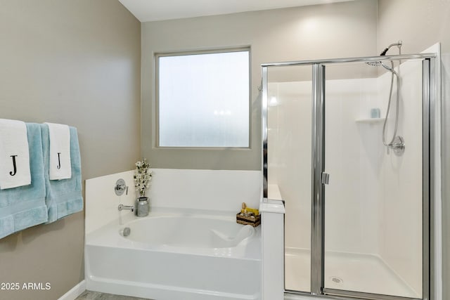 30776 W Earll Dr, Buckeye, AZ 85396 - full bath featuring a stall shower, a garden tub, and baseboards