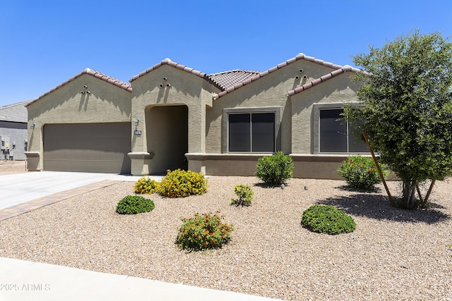 30776 W Earll Dr, Buckeye, AZ 85396 - mediterranean / spanish-style home with a garage, stucco siding, concrete driveway, and a tiled roof
