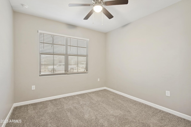 30776 W Earll Dr, Buckeye, AZ 85396 - spare room featuring carpet, baseboards, and a ceiling fan