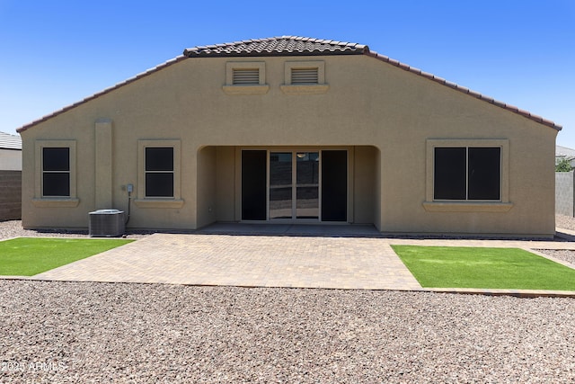 30776 W Earll Dr, Buckeye, AZ 85396 - back of house with a tiled roof, stucco siding, cooling unit, and a patio area