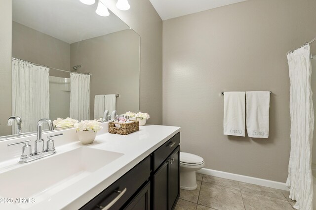 30776 W Earll Dr, Buckeye, AZ 85396 - full bathroom featuring vanity, baseboards, toilet, and tile patterned floors