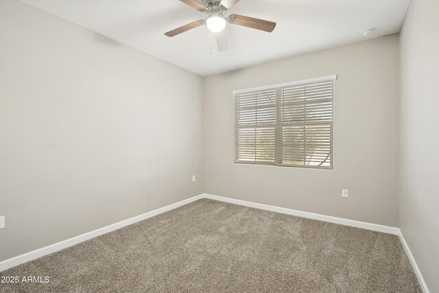 30776 W Earll Dr, Buckeye, AZ 85396 - carpeted spare room with baseboards, a ceiling fan, and a smoke detector