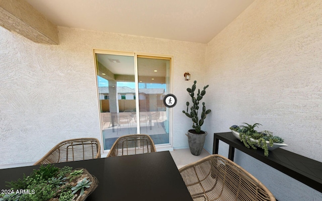 exterior space featuring a textured wall