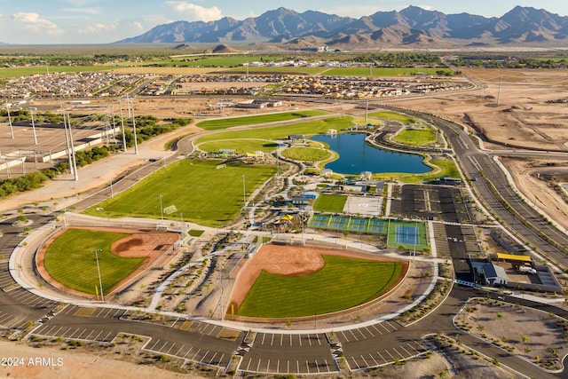 drone / aerial view featuring a water and mountain view