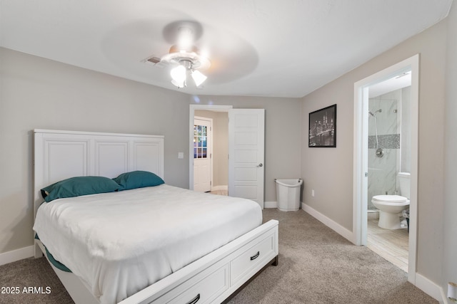 bedroom with ceiling fan, connected bathroom, and light carpet