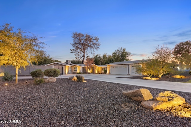 ranch-style house featuring a garage