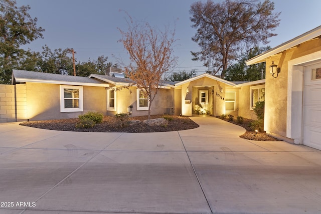 single story home featuring a garage