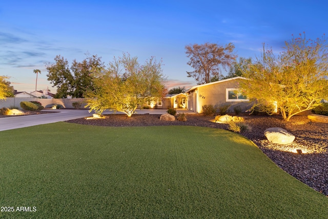 view of front of property with a yard