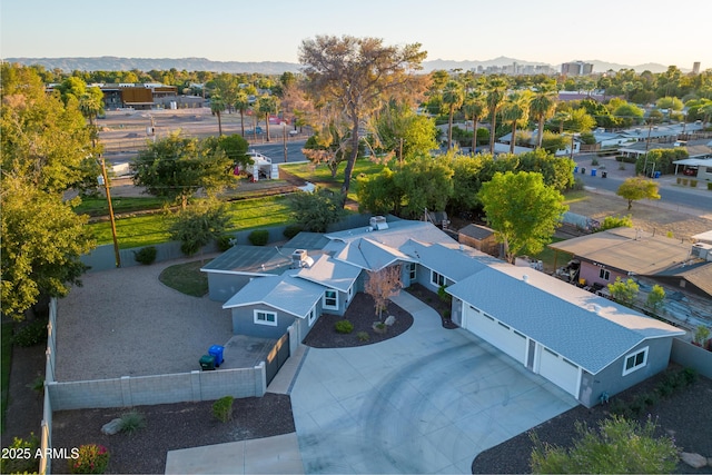 birds eye view of property with a mountain view