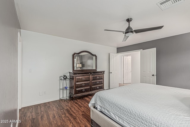 9035 W Villa Chula, Peoria, AZ 85383 - bedroom featuring baseboards, a ceiling fan, dark wood-style flooring, and visible vents