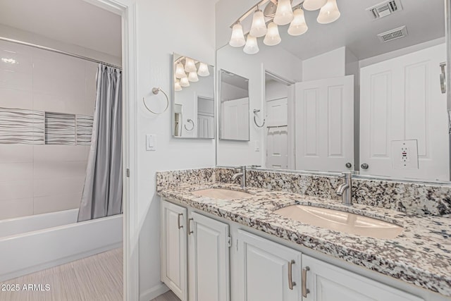 9035 W Villa Chula, Peoria, AZ 85383 - bathroom with visible vents, shower / bath combination with curtain, and a sink