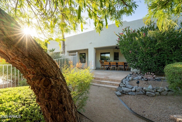 9035 W Villa Chula, Peoria, AZ 85383 - rear view of house featuring a patio, ceiling fan, fence, and stucco siding