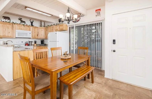 2868 Park Cir Unit 38, Pinetop, AZ 85935 - dining room featuring a chandelier and beamed ceiling