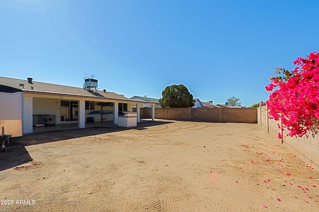 view of yard featuring a patio and central air condition unit