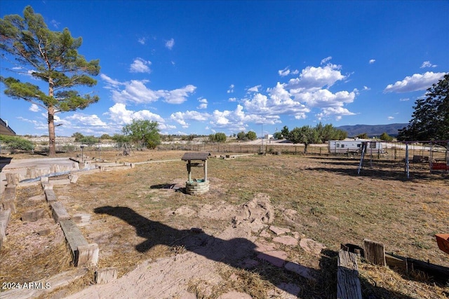 view of yard with a rural view