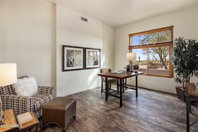 home office featuring visible vents and wood finished floors