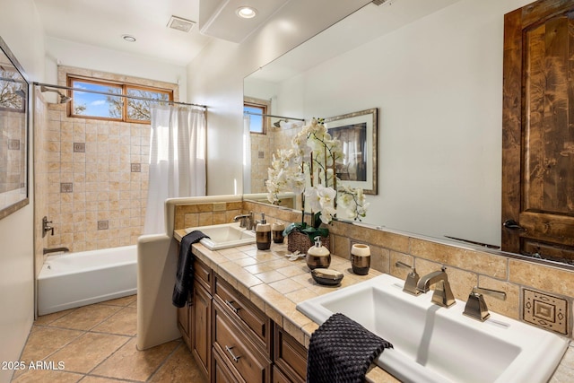 bathroom featuring a sink, visible vents, shower / tub combo with curtain, and recessed lighting