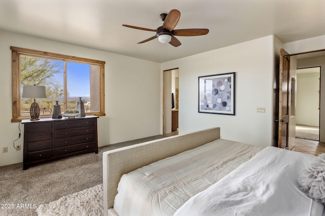 bedroom featuring a ceiling fan and light carpet