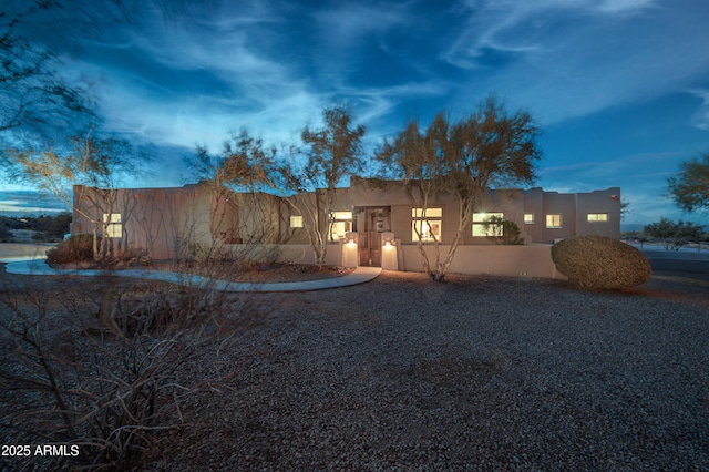 view of front of home featuring stucco siding