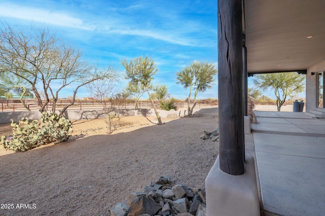 view of yard with a patio and fence