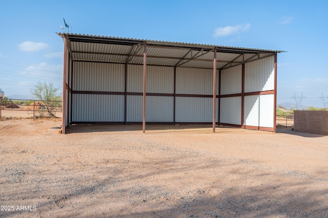 view of pole building featuring fence