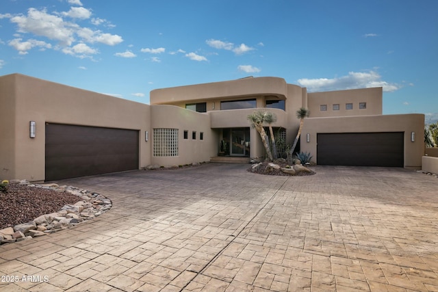 southwest-style home with a garage