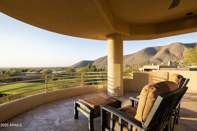 view of patio / terrace featuring a mountain view and a balcony