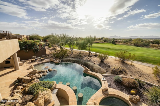 view of pool with a patio area, a jacuzzi, and a mountain view