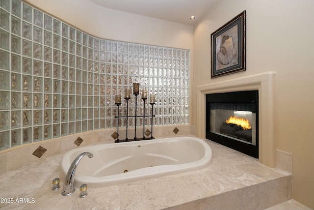 bathroom featuring tiled bath