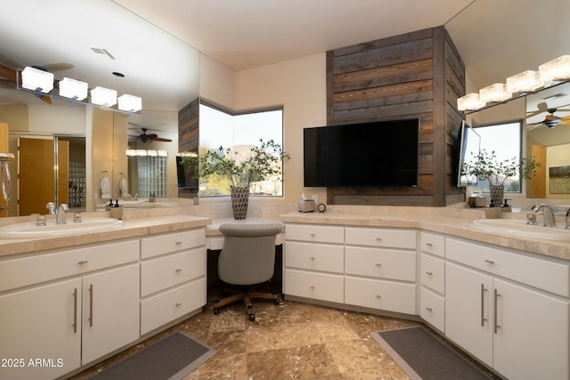 bathroom with ceiling fan and vanity