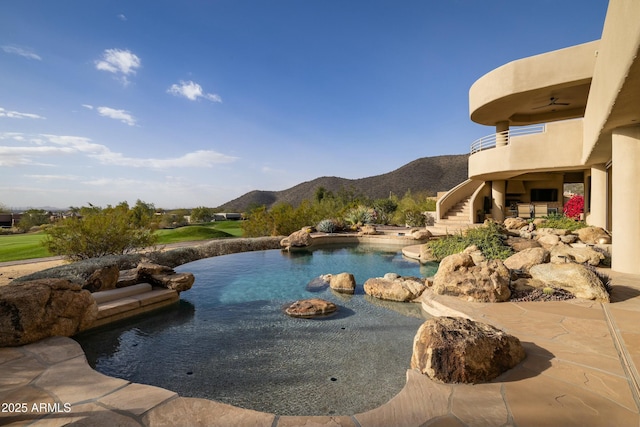 view of swimming pool with ceiling fan