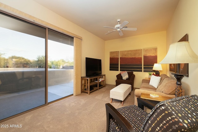 living room featuring ceiling fan and light carpet