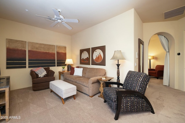 living room with ceiling fan and light colored carpet