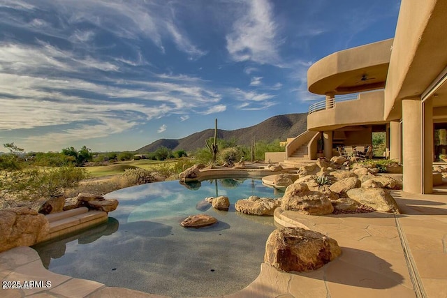 view of swimming pool featuring a mountain view