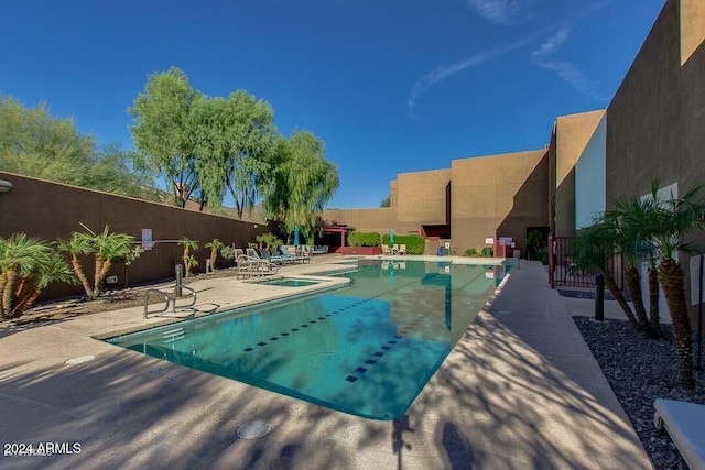 view of pool featuring a patio