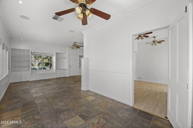 unfurnished living room featuring ornamental molding