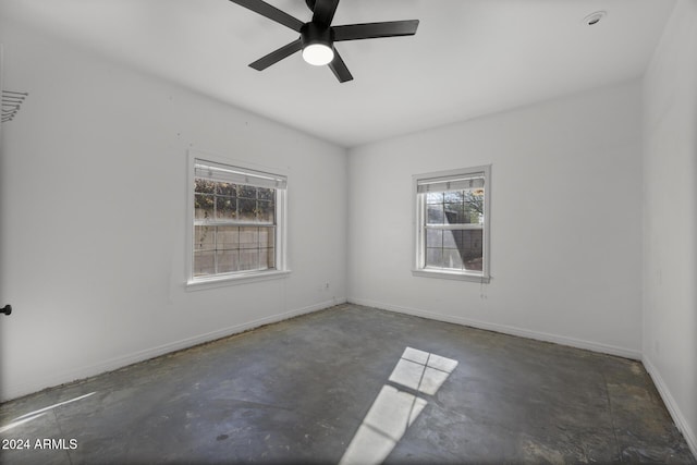 unfurnished room with ceiling fan