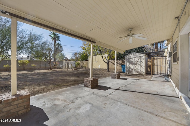 view of patio / terrace featuring ceiling fan and a shed