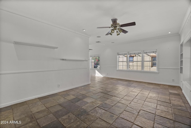 empty room with ceiling fan and crown molding