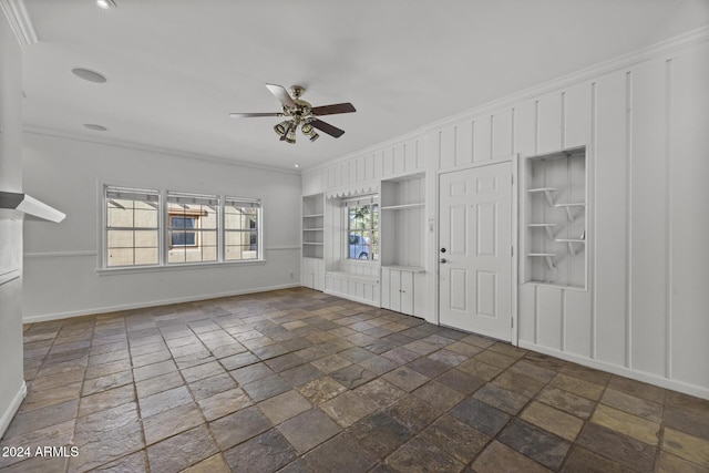 interior space with ceiling fan, built in features, and crown molding