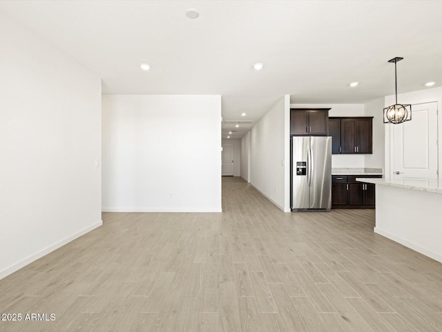 unfurnished living room with light wood-type flooring